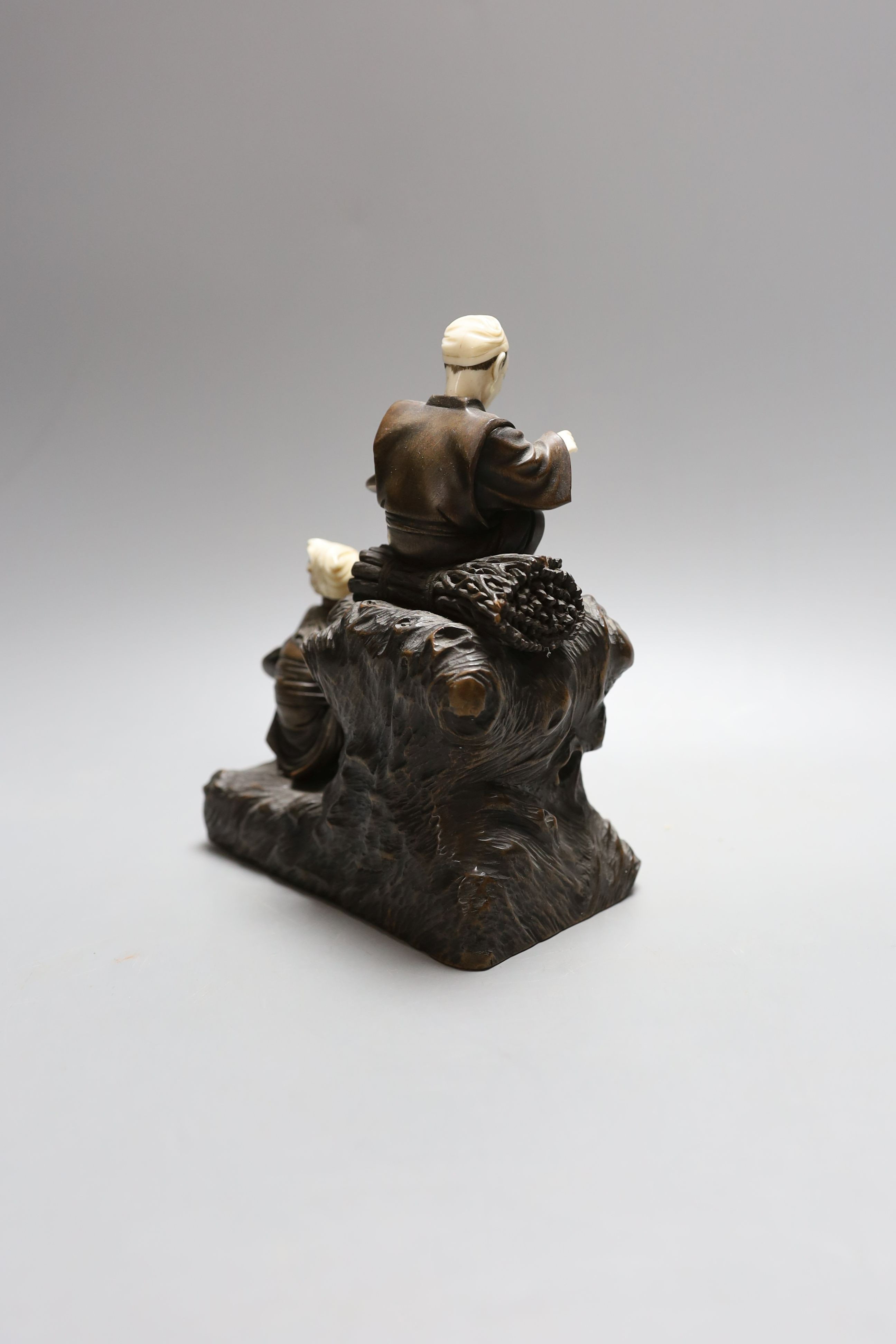 A Japanese ivory and wood figural okimono, Meiji period - 18.5cm tall